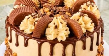 Reese's Peanut Butter Cup Cheesecake with chocolate ganache, peanut butter frosting and mini Reese's cups