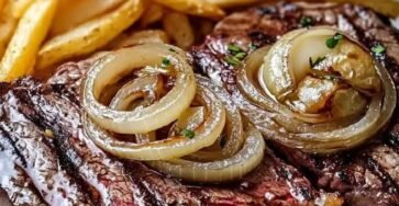 Juicy slow cooker maple balsamic beef pot roast served with caramelized onions and crispy French fries