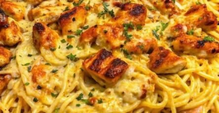 Creamy Monterey Jack chicken spaghetti topped with golden seasoned chicken pieces, melted cheese, and fresh parsley.