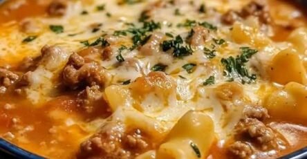 Creamy slow cooker lasagna soup with ground beef, tender noodles, tomato broth, and melted mozzarella cheese