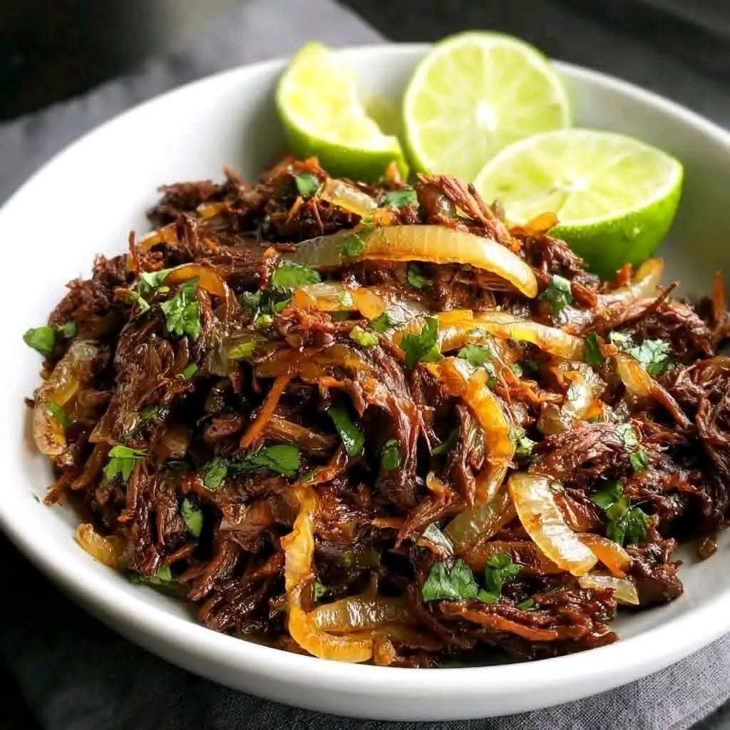 Crispy Cuban shredded beef with lime, garlic, caramelized onions, and fresh cilantro