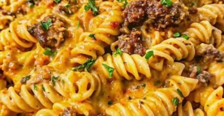Creamy garlic beef rotini pasta with ground beef and cheddar cheese sauce