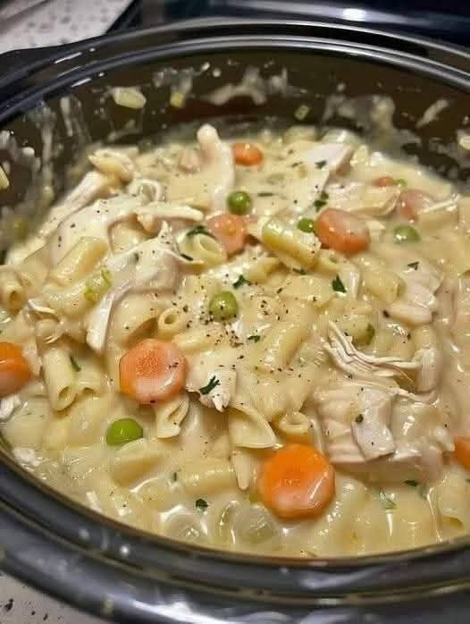 5-star creamy chicken noodle soup with tender chicken, carrots, peas, and pasta