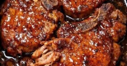 Tender slow cooker pork chops with a rich glossy glaze
