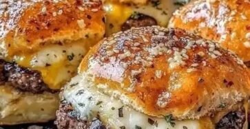 Garlic Parmesan cheeseburger bombs with seasoned beef, melted cheese, and golden sesame buns