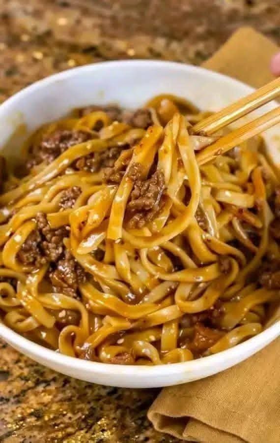 Bowl of savory ground beef noodles coated in a flavorful sauce