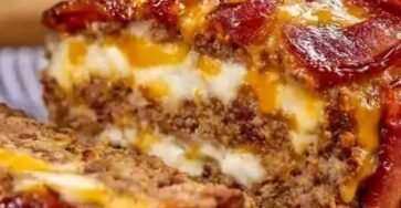 Smoked bacon meatloaf stuffed with melted triple cheese and topped with bacon